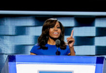 Rumor Mill STUMPED — Obamas Tag-Team On-Air I dont know who this is speaking at a podium