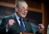 Schumer Goes All-In on Maine’s Controversial Candidate A politician delivering a passionate speech at a podium