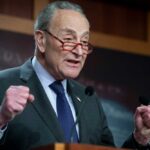 Schumer Goes All-In on Maine’s Controversial Candidate A politician delivering a passionate speech at a podium