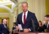 Capitol Standoff Freezes America’s Eyes Abroad A government official holding a document in a formal setting