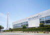Cafeteria Millionaires? SpaceX Stuns Wall Street SpaceX headquarters with Falcon 9 booster displayed outside