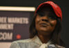 Evidence Avalanche Undercuts Candace Claims Woman in a red baseball cap holding a microphone