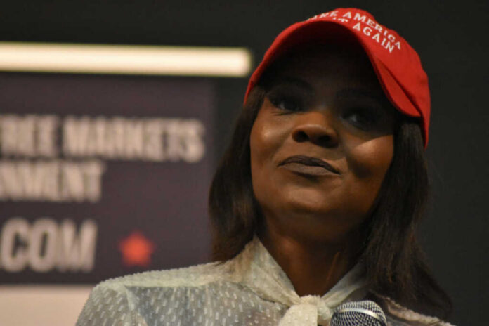 candace-owens1232508256jpg Woman in a red baseball cap holding a microphone