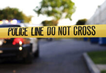 Wrong Man Dead — DHS Chaos Erupts Yellow police tape with text police line do not cross