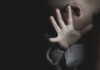 World Cup Sting: Children Pulled From Predators Child covering face with hand in dim light
