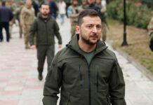 Kyiv’s Shield Vanishes — Missiles Rip Through Zelensky walking outdoors with military personnel nearby.