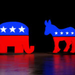 Senators Demand Slogan, Nominee Won’t Bite Red and blue elephant and donkey symbols dark background