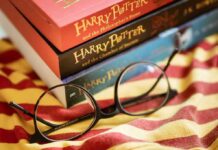 Tim Hortons Dragged Into Rowling Firestorm Round black glasses on striped scarf beside Harry Potter books