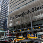 Court Twist Supercharges Trump’s NYT War The New York Times building facade with logo on metal screen
