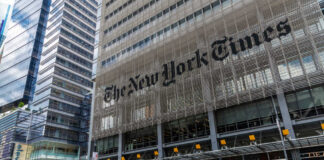 The New York Times building facade with logo on metal screen