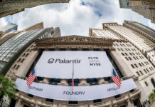 AI Token Tolls Gut Enterprise Edge Palantir Technologies banner displayed on the New York Stock Exchange building