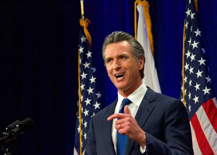 Sacramento,,Ca,-,March,8,,2022:,California,Governor,Gavin,Newsom California governor speaking at a construction site with smiling attendees