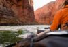 Mystery Illness Haunts Grand Canyon Rafters Hiker overlooking expansive canyon landscape