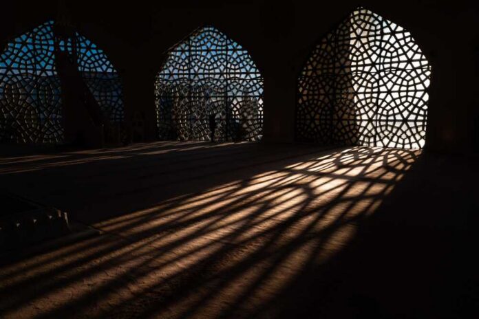 Islamic,Concept,Photo.,Islamic,Pattern,On,The,Window,And,Shadows Interior view showcasing intricate geometric patterns and shadows cast by windows