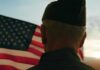Steak ’n Shake Hands Veterans The Keys A veteran in uniform standing in front of an American flag at sunset