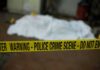 France Shaken: Epstein Link Dies Mid‑Probe crime scene tape in foreground with covered body in background