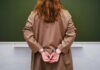 Teen Hit For Pro-America Gear? Person in handcuffs facing a chalkboard