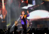 Concert Civil War: Songs Or Sermons? Lead singer performing on stage at a large concert