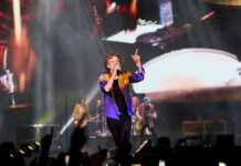 Concert Civil War: Songs Or Sermons? Lead singer performing on stage at a large concert