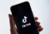 Smartphone displaying TikTok app logo on screen