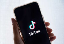 Smartphone displaying TikTok app logo on screen