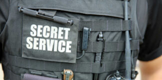 Tactical vest with equipment and a visible service patch