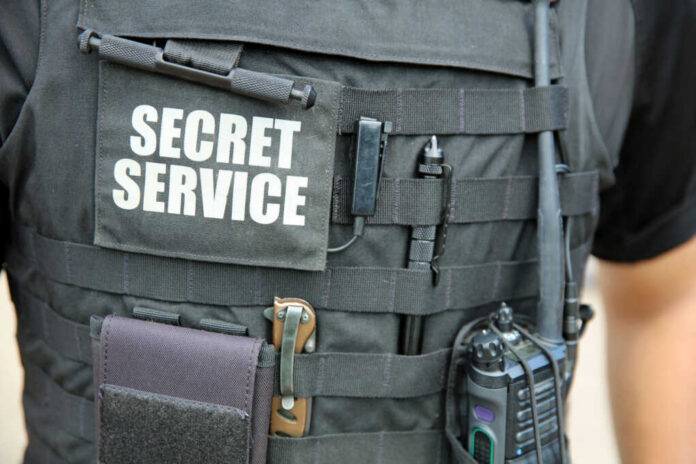 Tactical vest with equipment and a visible service patch