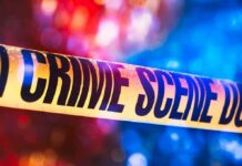 Dying Call Names Ex—Arrest Follows Fast Crime scene tape with blurred emergency lights in background