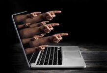 Congress: Laptop Real — Twitter Hit The Brakes Laptop with multiple hands pointing from the screen