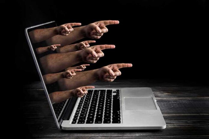 Laptop with multiple hands pointing from the screen