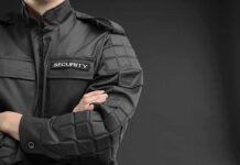 Security Orders Cover-Up — League Backtracks security guard in black uniform with crossed arms