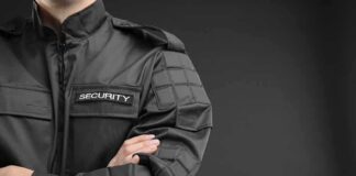 security guard in black uniform with crossed arms