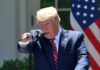 CFTC Smacks Insider Bets On Trump Words speaker at podium pointing during outdoor press event