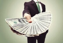 Legal Vote-Buying Rocks California Businessperson holding a fan of US dollar bills