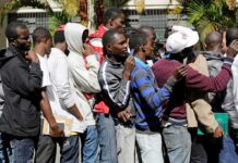 Group of men standing in a line outdoors