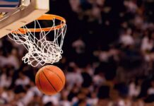 Basketball dropping through a hoop