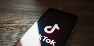 Smartphone displaying TikTok app logo on screen