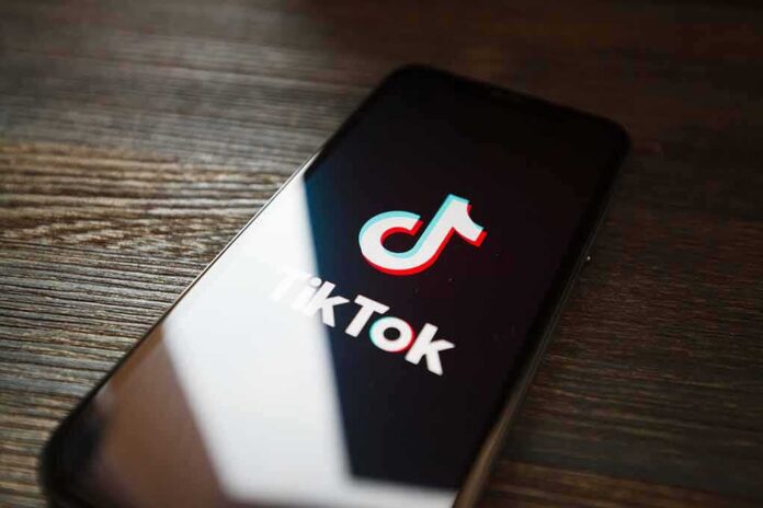 Smartphone displaying TikTok app logo on screen