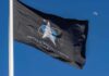 Russia Cries NUKES — X-37B Under Fire United States Space Force flag waving against a blue sky