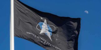 United States Space Force flag waving against a blue sky