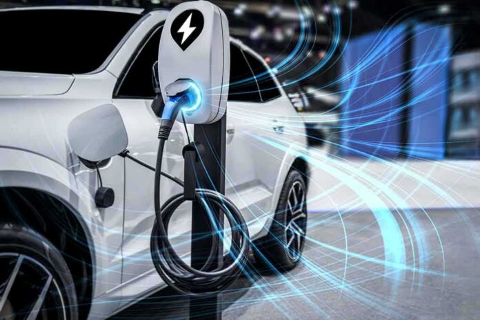 shutterstock_2029089575 Electric car charging at a station