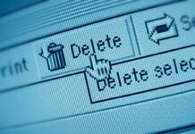 Close-up of a computer screen showing a delete button with a cursor hovering over it