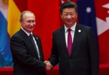 Xi-Putin Tag Team? Europe on Notice two men in suits shaking hands