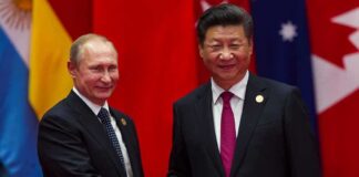 two men in suits shaking hands