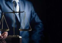 Unanimous Hit: Billionaire Stonewall Backfires Scales of justice held by a person in a suit