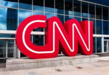 Viewpoint Vengeance? CNN Locked Out CNN red logo sculpture outside a modern glass building