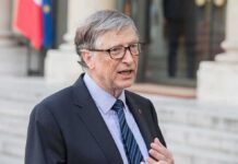 AI Runaway Risk? Gates Urges Emergency Rules man in suit speaking outdoors
