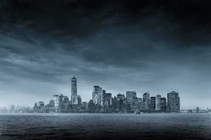 shutterstock_1120723769 city skyline across water under overcast sky