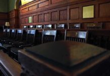 DA Yanks Death Penalty In Hollywood Double Murder Empty wooden jury box with numbered chairs