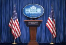 NATO Shock: Ally Blocks U.S. Strikes White House press podium with microphones and two American flags
